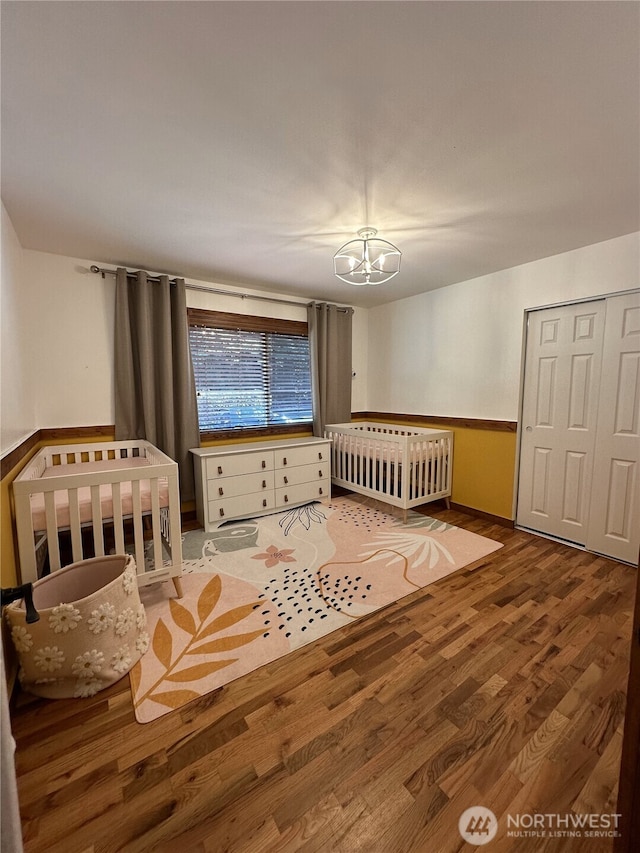 1360 Colchester Dr SE, Port Orchard, WA 98366 - unfurnished bedroom featuring a chandelier, wood finished floors, and a closet