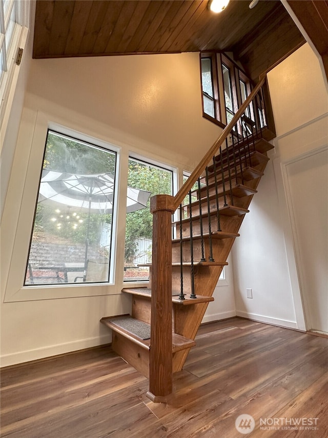 1360 Colchester Dr SE, Port Orchard, WA 98366 - staircase with wood ceiling, baseboards, wood finished floors, and high vaulted ceiling