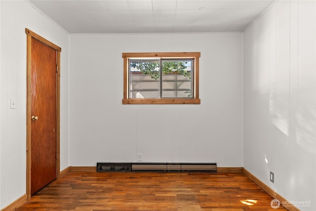 318 Lombard St, Twisp, WA 98856 - spare room featuring wood finished floors, ornamental molding, and baseboards