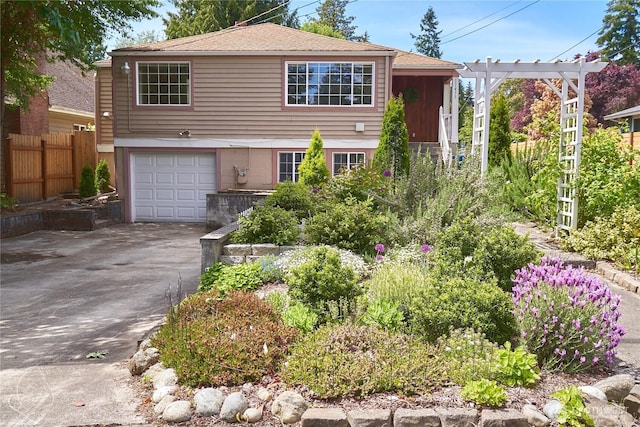 11433 12th Ave SW, Burien, WA 98146 - view of front of house with an attached garage, asphalt driveway, and roof with shingles