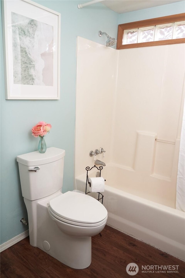 11433 12th Ave SW, Burien, WA 98146 - full bath with toilet, shower / bath combination with curtain, wood finished floors, and baseboards