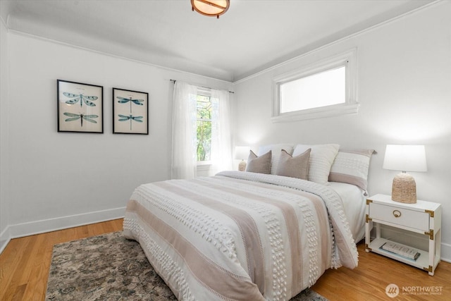 3526 Ashworth Ave N, Seattle, WA 98103 - bedroom featuring baseboards, wood finished floors, and ornamental molding