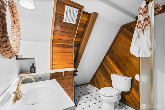 5617 236th Ave NE, Redmond, WA 98053 - bathroom with wooden walls, toilet, and a sink