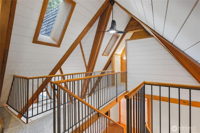 5617 236th Ave NE, Redmond, WA 98053 - stairway featuring wooden walls, a skylight, and vaulted ceiling