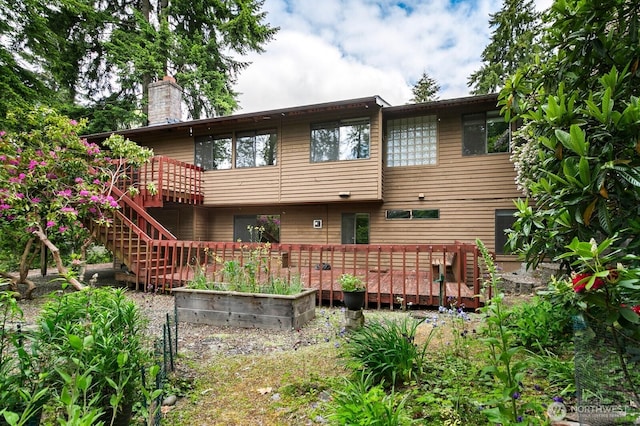 13219 SE 52nd Pl, Bellevue, WA 98006 - back of house featuring a wooden deck and a chimney