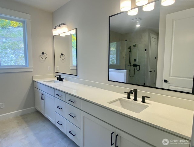 2532 Acer Loop SE, Lacey, WA 98513 - bathroom featuring double vanity, a stall shower, baseboards, and tile patterned flooring