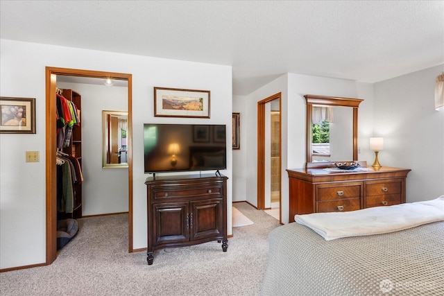 4920 90th Pl SW, Mukilteo, WA 98275 - bedroom featuring a spacious closet, light colored carpet, a closet, baseboards, and ensuite bathroom