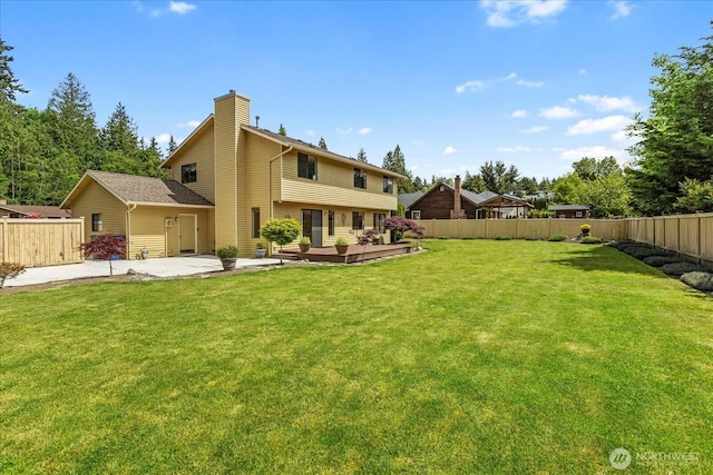 4920 90th Pl SW, Mukilteo, WA 98275 - rear view of property with a chimney, a patio, and a wooden deck
