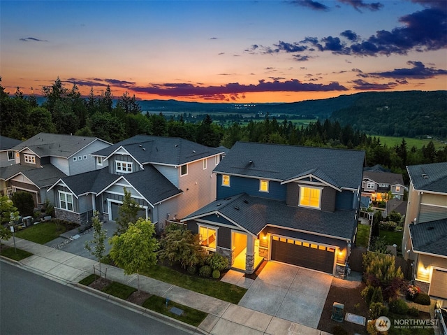28616 NE 155th St, Duvall, WA 98019 - craftsman-style house featuring stone siding, driveway, a residential view, and a garage