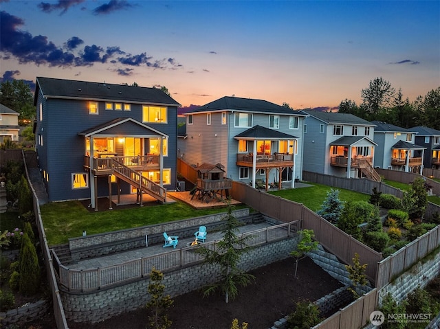 28616 NE 155th St, Duvall, WA 98019 - back of house at dusk featuring stairs, a deck, and a residential view