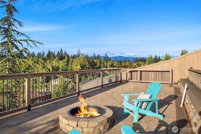28616 NE 155th St, Duvall, WA 98019 - wooden deck featuring a fire pit, a patio, and a mountain view