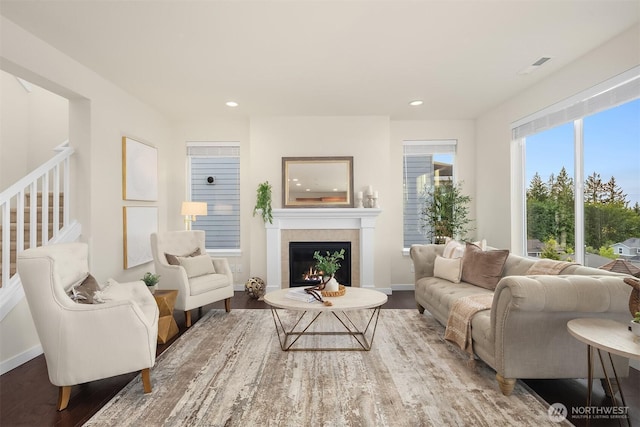 28616 NE 155th St, Duvall, WA 98019 - living room featuring wood finished floors, a tile fireplace, stairs, baseboards, and recessed lighting