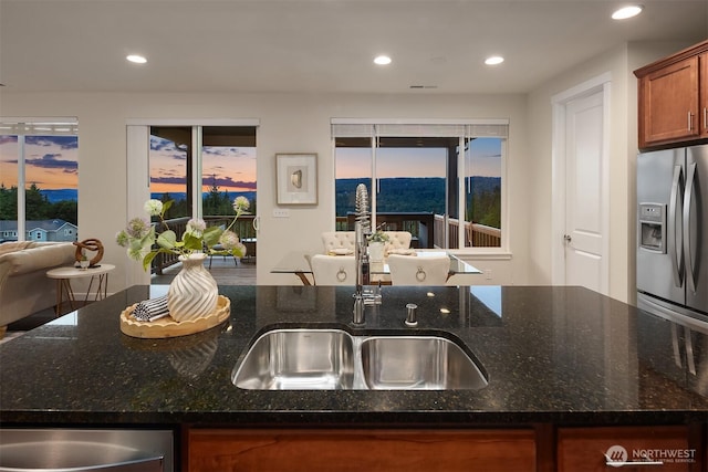28616 NE 155th St, Duvall, WA 98019 - kitchen featuring appliances with stainless steel finishes, recessed lighting, a sink, dark stone countertops, and healthy amount of natural light