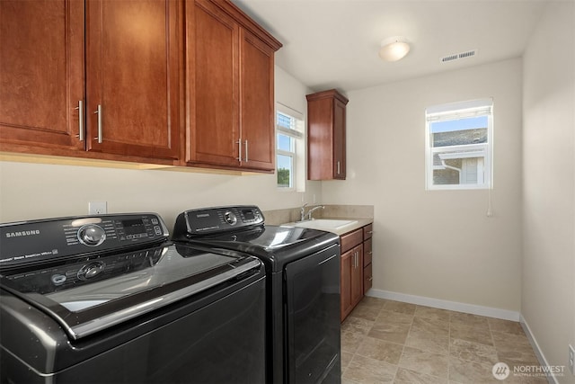 28616 NE 155th St, Duvall, WA 98019 - washroom with washing machine and clothes dryer, baseboards, and cabinet space