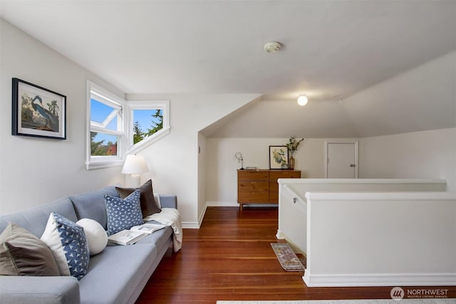 1635 46th Ave SW, Seattle, WA 98116 - living room featuring dark wood-type flooring, vaulted ceiling, and baseboards