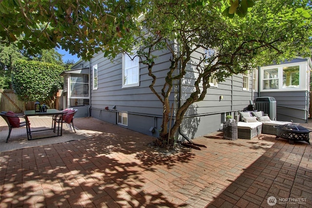 1635 46th Ave SW, Seattle, WA 98116 - view of patio with central AC unit, an outdoor living space with a fire pit, and outdoor dining space