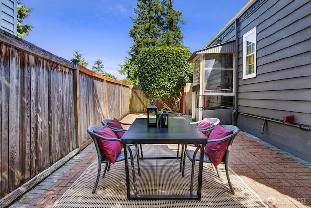 1635 46th Ave SW, Seattle, WA 98116 - fenced backyard with outdoor dining space and a patio