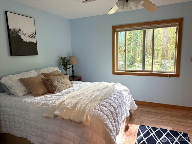 7480 Glacier Springs Dr, Deming, WA 98244 - bedroom with wood finished floors, baseboards, and ceiling fan