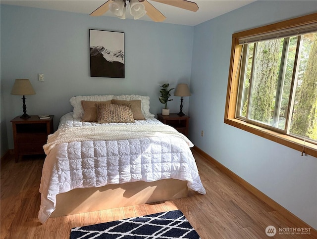 7480 Glacier Springs Dr, Deming, WA 98244 - bedroom featuring wood finished floors, baseboards, and a ceiling fan