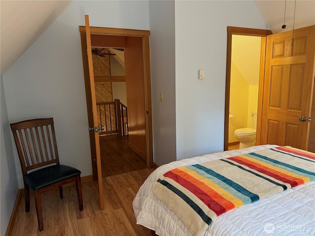 7480 Glacier Springs Dr, Deming, WA 98244 - bedroom with lofted ceiling, wood finished floors, baseboards, and ensuite bath