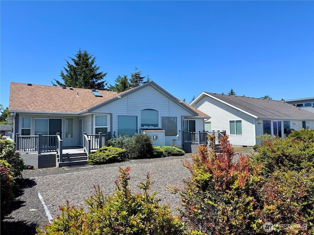 374 Harbor View Loop SE, Ocean Shores, WA 98569 - rear view of property with a wooden deck
