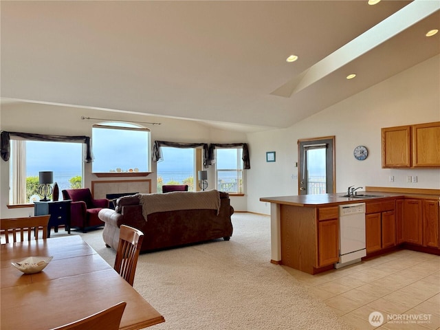 374 Harbor View Loop SE, Ocean Shores, WA 98569 - kitchen featuring white dishwasher, open floor plan, brown cabinets, recessed lighting, and a peninsula