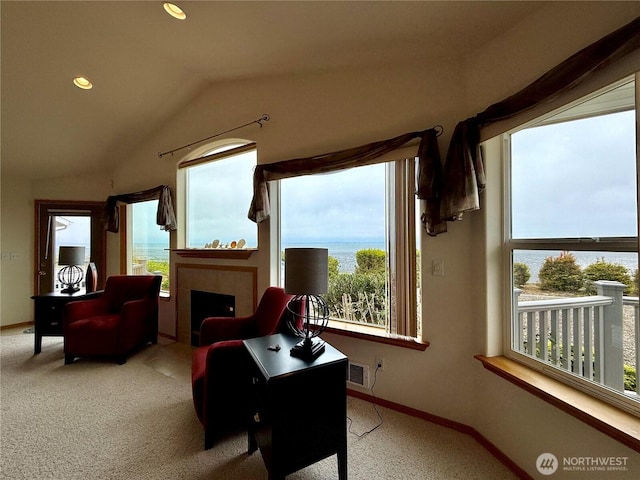 374 Harbor View Loop SE, Ocean Shores, WA 98569 - living area featuring carpet, lofted ceiling, baseboards, a fireplace, and recessed lighting