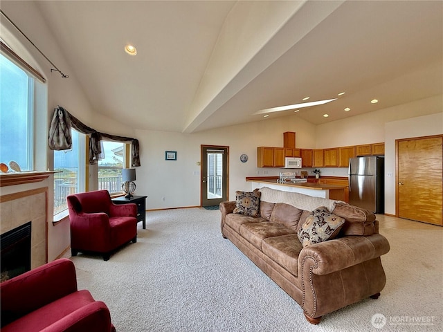 374 Harbor View Loop SE, Ocean Shores, WA 98569 - living area with vaulted ceiling, light colored carpet, recessed lighting, baseboards, and a fireplace