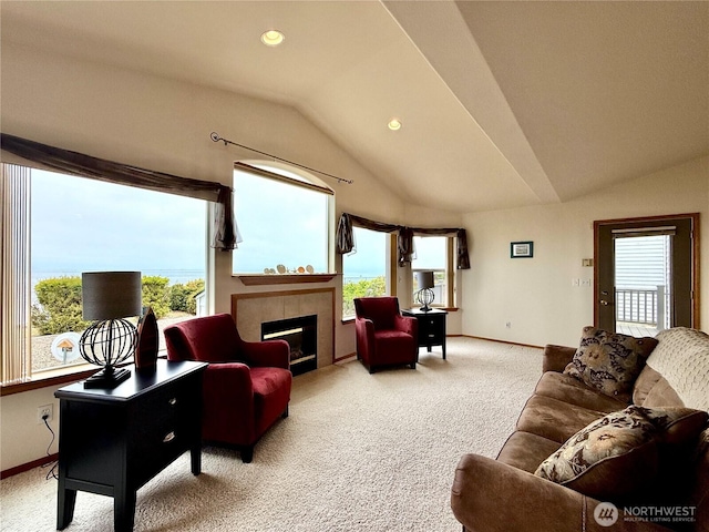 374 Harbor View Loop SE, Ocean Shores, WA 98569 - living room with lofted ceiling, light colored carpet, baseboards, a tiled fireplace, and recessed lighting