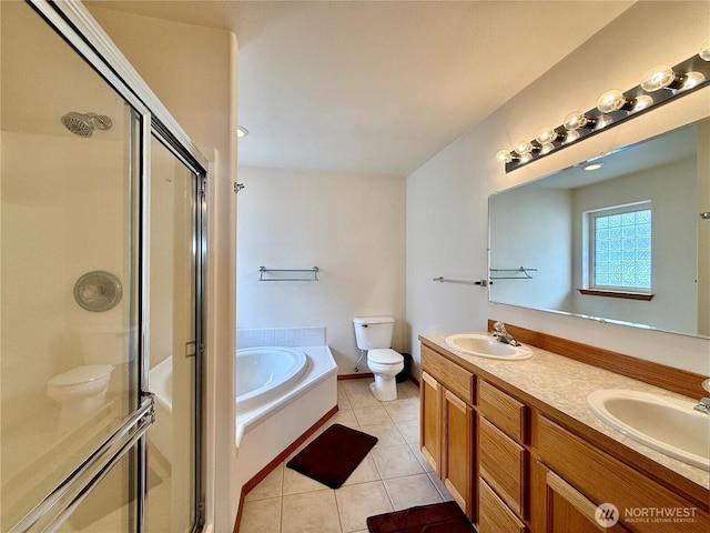 374 Harbor View Loop SE, Ocean Shores, WA 98569 - bathroom with toilet, a garden tub, a shower stall, tile patterned flooring, and double vanity