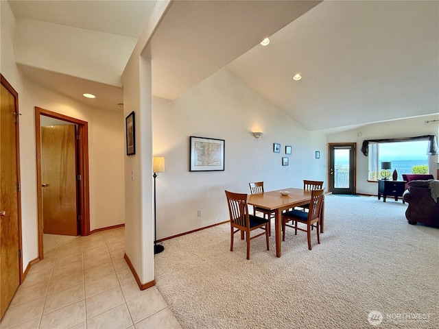 374 Harbor View Loop SE, Ocean Shores, WA 98569 - dining room with baseboards, light colored carpet, light tile patterned floors, recessed lighting, and high vaulted ceiling