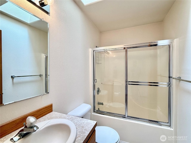374 Harbor View Loop SE, Ocean Shores, WA 98569 - bathroom with vanity, toilet, and enclosed tub / shower combo