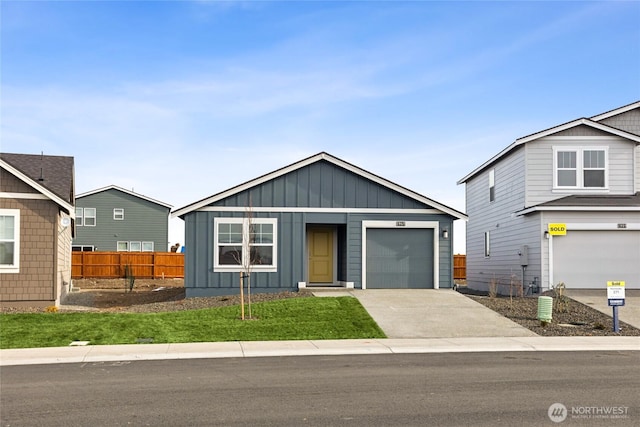 2967 Longhorn Loop Unit 275, Ellensburg, WA 98926 - view of front of house with board and batten siding, concrete driveway, and an attached garage