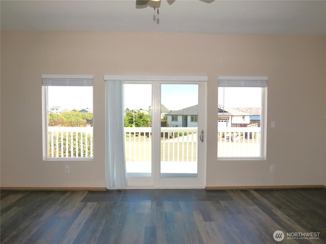 1080 Greenview Ct SW, Ocean Shores, WA 98569 - doorway featuring plenty of natural light, dark wood-style floors, ceiling fan, and baseboards