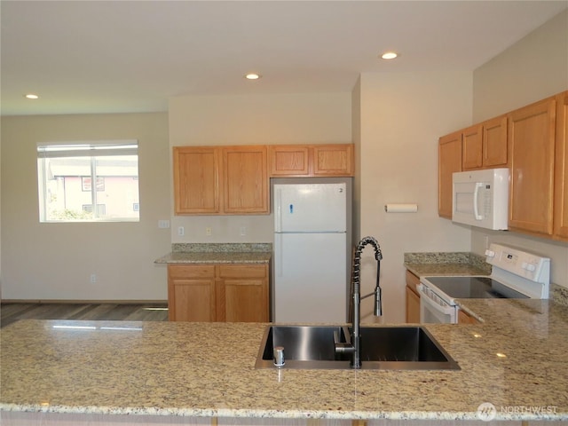 1080 Greenview Ct SW, Ocean Shores, WA 98569 - kitchen with white appliances, a sink, light stone countertops, wood finished floors, and recessed lighting
