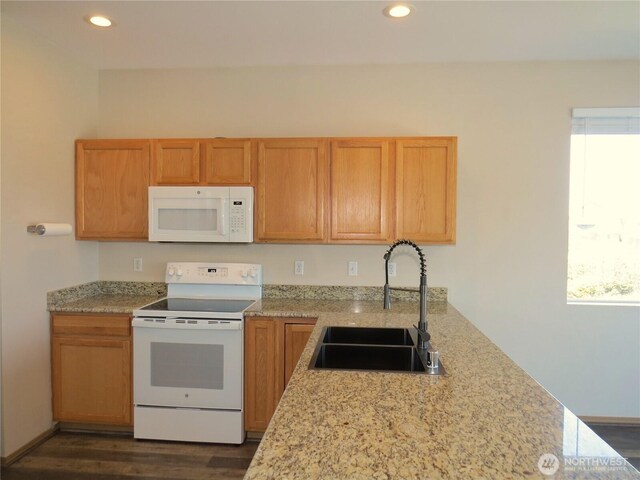 1080 Greenview Ct SW, Ocean Shores, WA 98569 - kitchen with white appliances, a sink, recessed lighting, dark wood-style floors, and light stone countertops