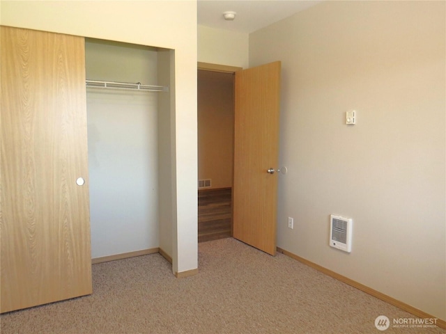 1080 Greenview Ct SW, Ocean Shores, WA 98569 - unfurnished bedroom with a closet, carpet, heating unit, and baseboards