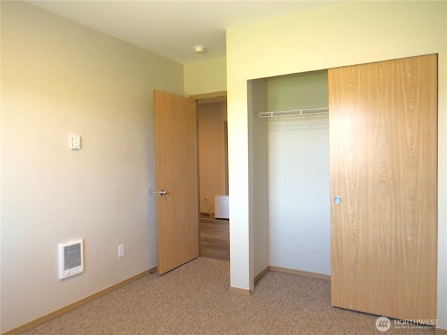 1080 Greenview Ct SW, Ocean Shores, WA 98569 - unfurnished bedroom with a closet, carpet, baseboards, and heating unit
