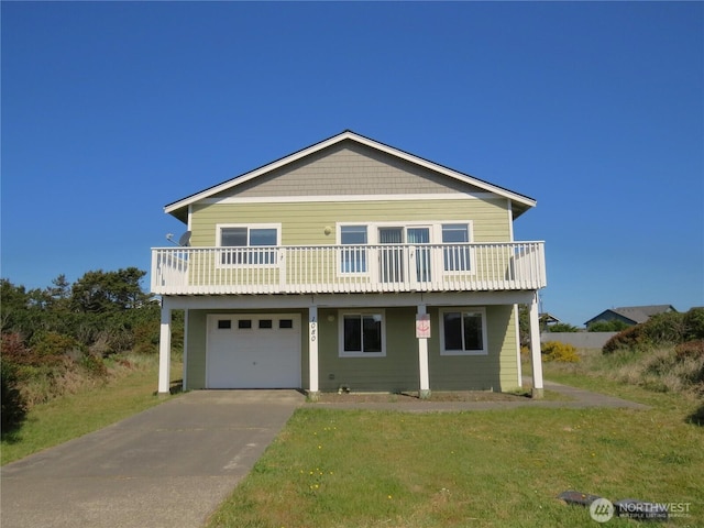 1080 Greenview Ct SW, Ocean Shores, WA 98569 - view of front of property with a garage, concrete driveway, a front lawn, and a balcony
