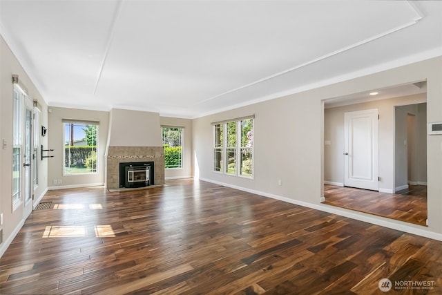 1701 W Yakima Ave, Yakima, WA 98902 - unfurnished living room featuring healthy amount of natural light, dark wood-style floors, and baseboards