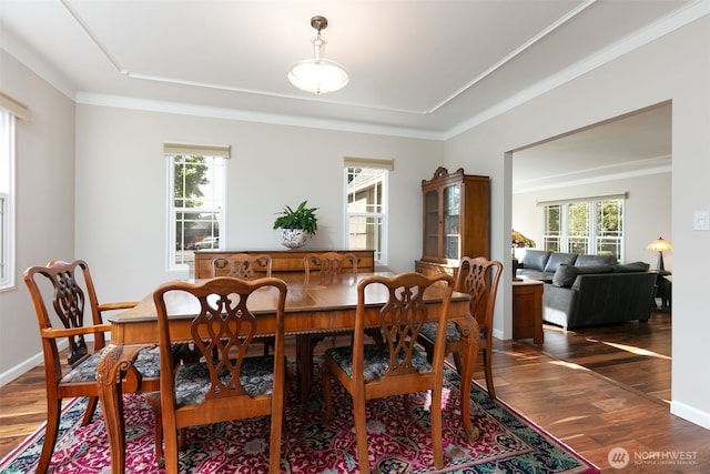 1701 W Yakima Ave, Yakima, WA 98902 - dining room featuring dark wood-style floors, a tray ceiling, and crown molding