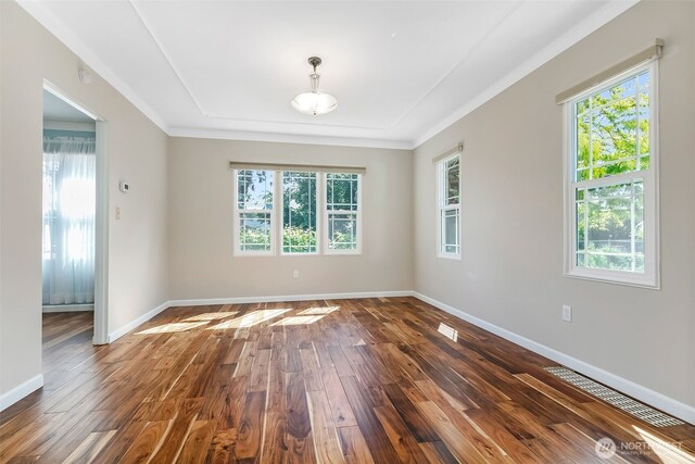 1701 W Yakima Ave, Yakima, WA 98902 - empty room featuring dark wood finished floors, baseboards, and crown molding