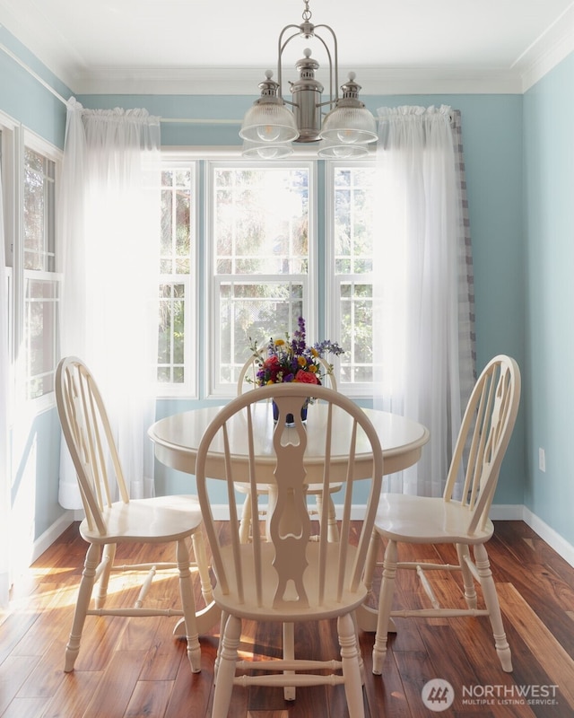 1701 W Yakima Ave, Yakima, WA 98902 - dining space with wood finished floors, crown molding, baseboards, and a chandelier