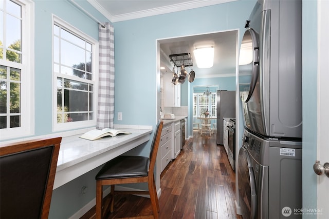 1701 W Yakima Ave, Yakima, WA 98902 - kitchen featuring estacked washer and dryer, crown molding, stainless steel appliances, dark wood-type flooring, and a chandelier