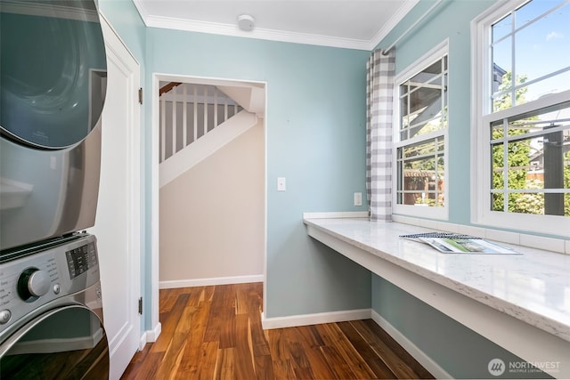 1701 W Yakima Ave, Yakima, WA 98902 - laundry room with stacked washer / drying machine, dark wood-style flooring, crown molding, healthy amount of natural light, and baseboards