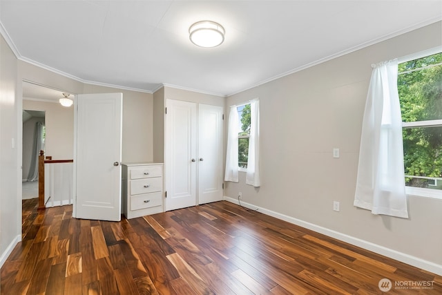 1701 W Yakima Ave, Yakima, WA 98902 - unfurnished bedroom with dark wood-style floors, multiple windows, baseboards, and ornamental molding