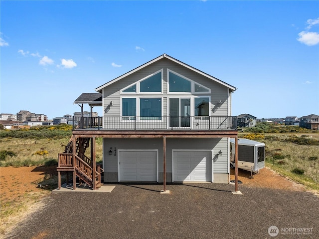 1438 Ocean Crest Ave SW, Ocean Shores, WA 98569 - chalet / cabin with stairway, a garage, and driveway