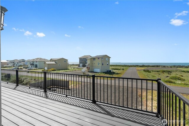 1438 Ocean Crest Ave SW, Ocean Shores, WA 98569 - wooden terrace featuring a residential view