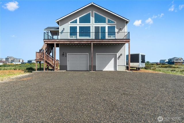 1438 Ocean Crest Ave SW, Ocean Shores, WA 98569 - coastal inspired home featuring stairway, a garage, and driveway