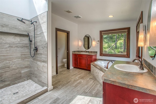 16 Village View Rd, Orcas Island, WA 98245 - bathroom featuring tiled shower, toilet, vanity, and a garden tub
